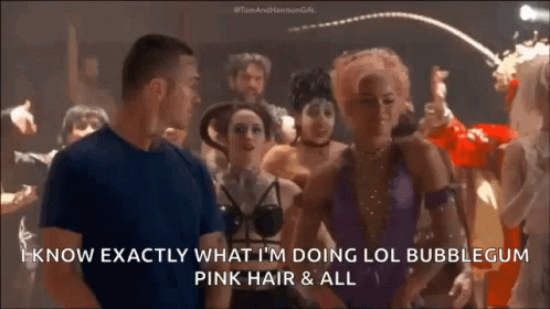 A Man And A Woman Are Standing In A Crowd And The Man Says I Know Exactly What I 'M Doing Lol GIF