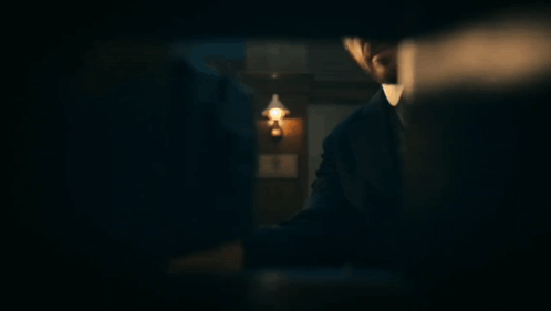 Man And Woman Standing In Dark Room With Nothing GIF