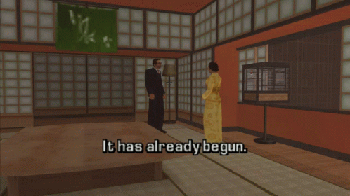 A Man And A Woman Are Standing In A Room With The Words It Has Already Begun GIF