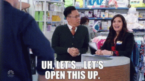 Man And Woman Talking In Store GIF