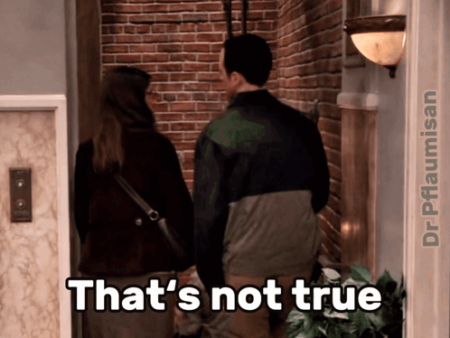 A Man And A Woman Are Standing In Front Of A Brick Wall And A Caption That Says That 'S Not True GIF