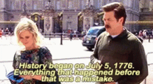 A Man And A Woman Are Standing In Front Of A Building That Says History Began On July 5 1776 . GIF