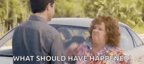 A Man And A Woman Are Standing In Front Of A Car . GIF