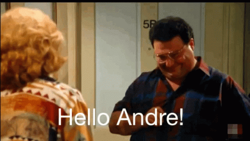 A Man And A Woman Are Standing In Front Of A Door And The Man Says Hello Andre GIF