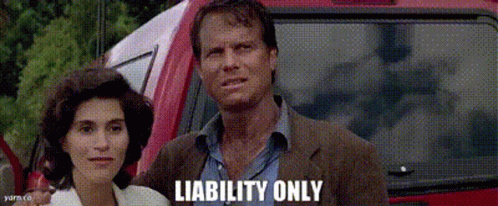 A Man And A Woman Are Standing In Front Of A Red Car With Liability Only Written On The Bottom Right GIF