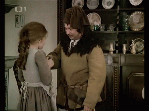 A Man And A Woman Are Standing In Front Of A Shelf With Plates On It And The Number 01 On The Bottom Right GIF
