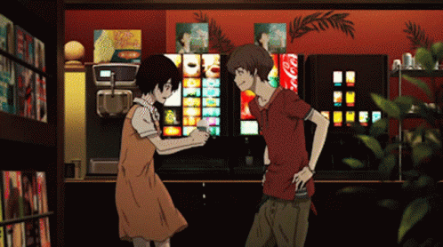 a man and a woman are standing in front of a vending machine that has a coca cola sign on it