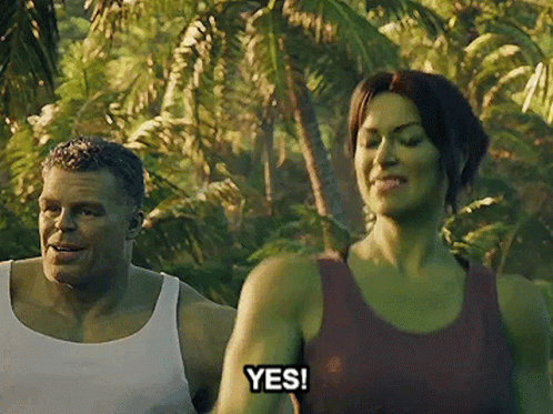 A Man And A Woman Are Standing In The Jungle And The Woman Is Saying Yes . GIF