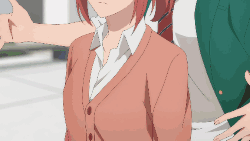 A Man And A Woman Are Standing Next To Each Other GIF