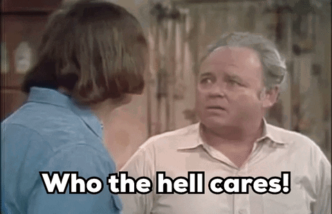 Man And Woman Talking, Man Says Who The Hell Cares GIF