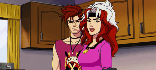 A Man And A Woman Are Standing Next To Each Other And The Man Has A Shirt That Says Roca On It GIF