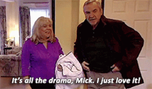 A Man And A Woman Are Standing Next To Each Other And The Man Is Saying It 'S All The Drama GIF