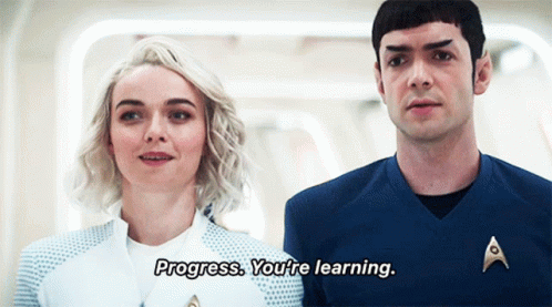 a man and a woman are standing next to each other and the man is saying progress you 're learning