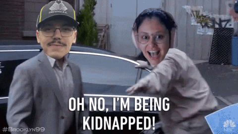 A Man And A Woman Are Standing Next To Each Other And The Man Is Wearing A Hat That Says Brooklyn 99 GIF