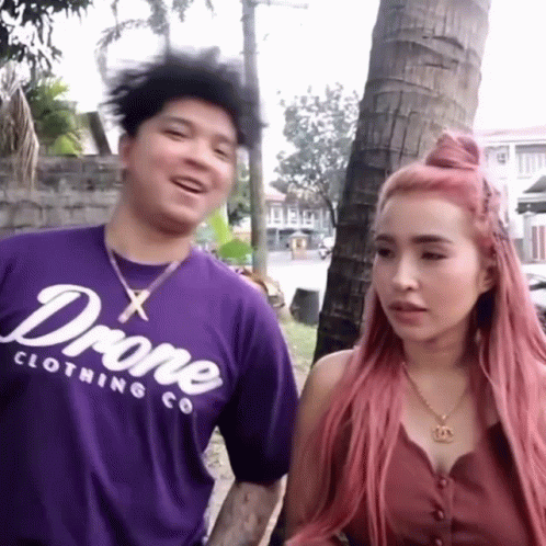 Man And Woman Standing, Man In Purple Drone Shirt GIF