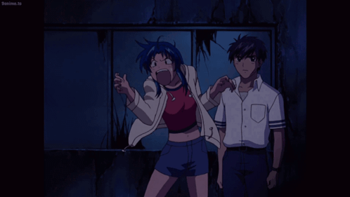 A Man And A Woman Are Standing Next To Each Other And The Man 'S Shirt Says Beanime.tv On It GIF
