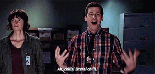 A Man And A Woman Are Standing Next To Each Other And The Man Says Ah Chills ! Literal Chills GIF