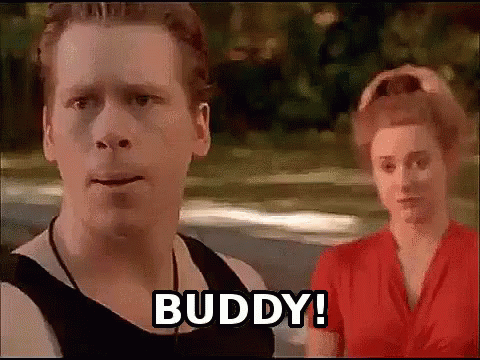 A Man And A Woman Are Standing Next To Each Other And The Man Says Buddy . GIF
