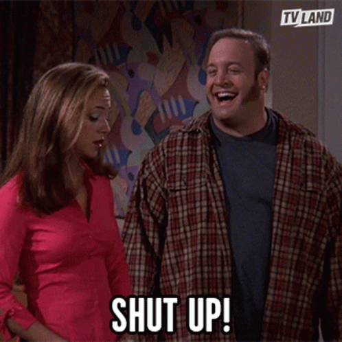 A Man And A Woman Are Standing Next To Each Other And The Man Says Shut Up GIF