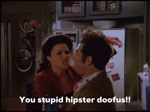 A Man And A Woman Are Standing Next To Each Other And The Man Says You Stupid Hipster Doofus ! GIF