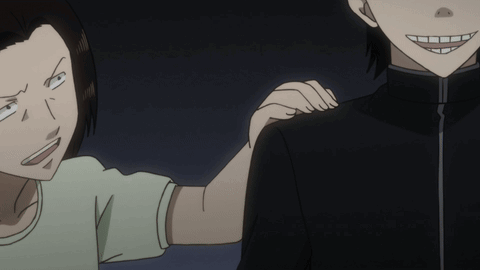 A Man And A Woman Are Standing Next To Each Other And The Woman Is Holding The Man 'S Arm GIF