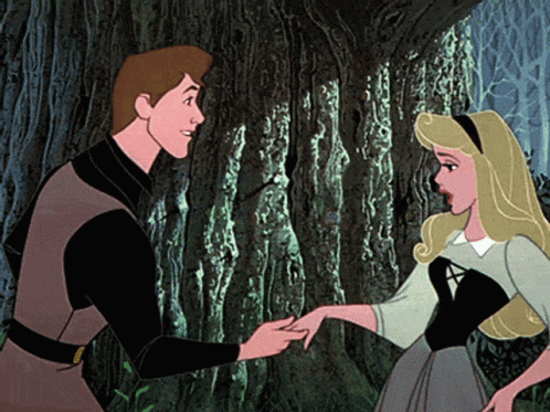 A Man And A Woman Are Standing Next To Each Other And The Woman Is Holding The Man 'S Hand GIF