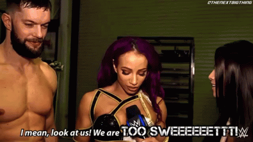 A Man And A Woman Are Standing Next To Each Other And The Woman Is Saying I Mean Look At Us We Are Too Sweet ! GIF