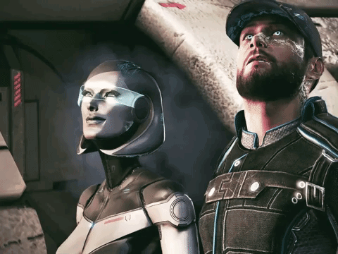 A Man And A Woman Are Standing Next To Each Other And The Woman Is Wearing A Helmet That Has The Letter U On It GIF