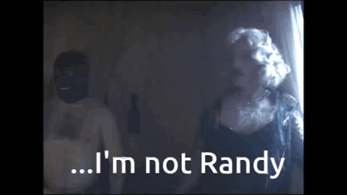 A Man And A Woman Are Standing Next To Each Other And The Woman Says I 'M Not Randy GIF