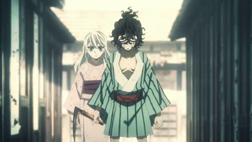 A Man And A Woman Are Standing Next To Each Other Holding Swords GIF