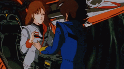 A Man And A Woman Are Standing Next To Each Other In A Cartoon GIF