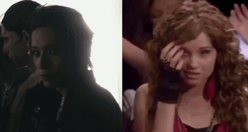 A Man And A Woman Are Standing Next To Each Other In A Dark Room And A Woman Is Crying . GIF