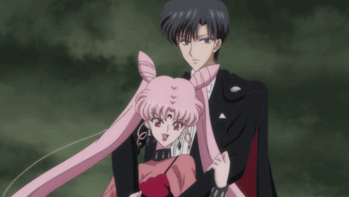 A Man And A Woman Are Standing Next To Each Other In A Dark Room GIF