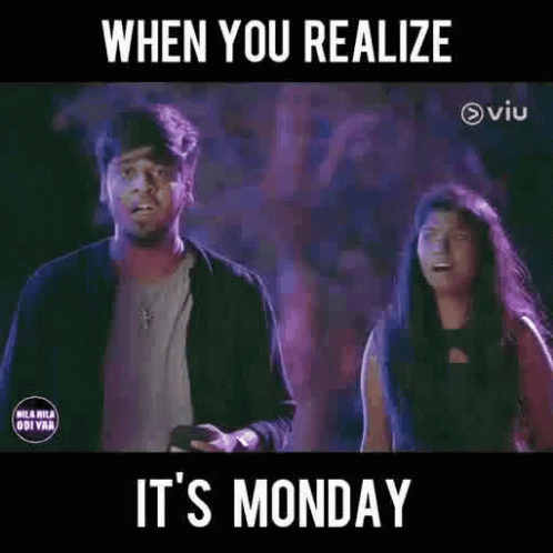 A Man And A Woman Are Standing Next To Each Other In A Dark Room With A Purple Background . GIF