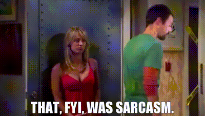 A Man And A Woman Are Standing Next To Each Other In A Doorway . The Woman Is Wearing A Red Dress . GIF