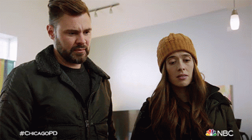 Man And Woman Standing Next To Each Other GIF