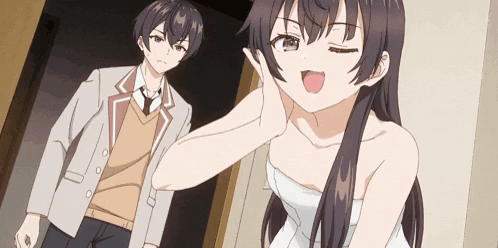 A Man And A Woman Are Standing Next To Each Other In A Room . GIF