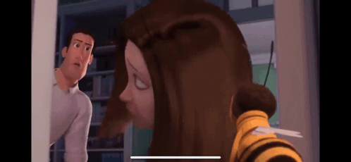 A Man And A Woman Are Standing Next To Each Other In A Room . The Woman Is Wearing A Bee Costume . GIF