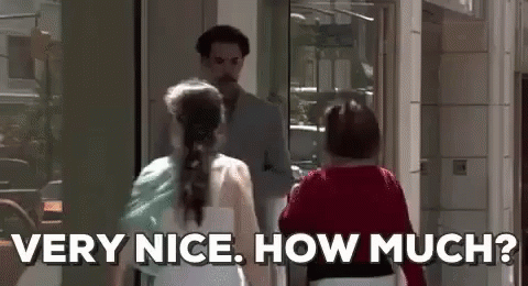 A Man And A Woman Are Standing Next To Each Other In Front Of A Building . The Woman Is Asking The Man How Much . GIF
