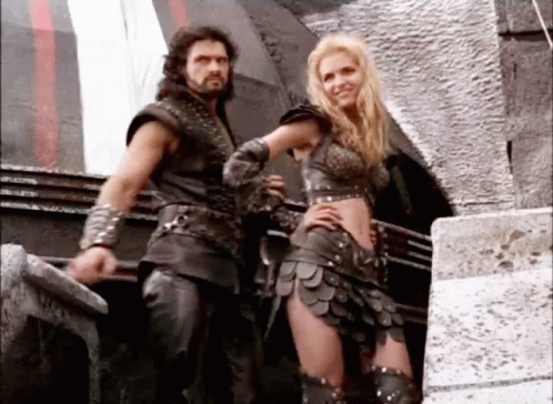 Man And Woman Standing Next To Each Other GIF