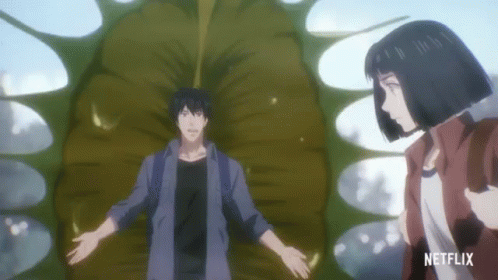 A Man And A Woman Are Standing Next To Each Other With A Netflix Logo On The Bottom GIF