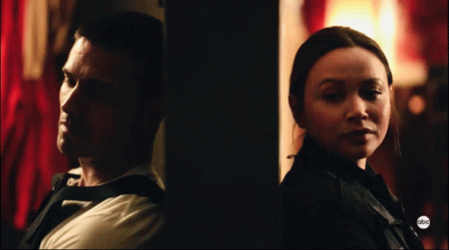 A Man And A Woman Are Standing Next To Each Other With The Abc Logo On The Bottom GIF