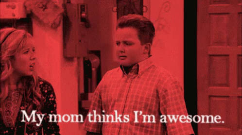 A Man And A Woman Are Standing Next To Each Other With The Words My Mom Thinks I 'M Awesome GIF