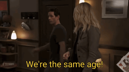 Man And Woman Standing Next To Each Other GIF