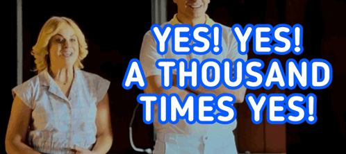 A Man And A Woman Are Standing Next To Each Other With The Words Yes Yes A Thousand Times Yes Behind Them GIF
