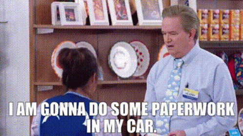 A Man And A Woman Are Talking In A Store . GIF