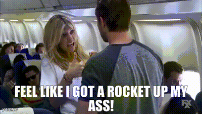 A Man And A Woman Are Talking On An Airplane And The Woman Is Saying " Feel Like I Got A Rocket Up My Ass " GIF