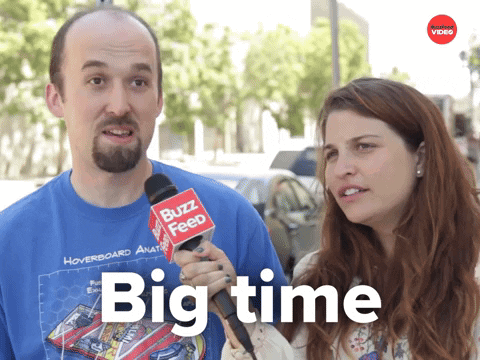 A Man And A Woman Are Talking To A Buzz Feed Reporter GIF