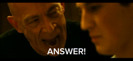 A Man And A Woman Are Talking To Each Other And The Man Is Saying `` Answer ! '' GIF