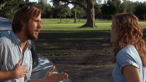 A Man And A Woman Are Talking To Each Other In A Field GIF